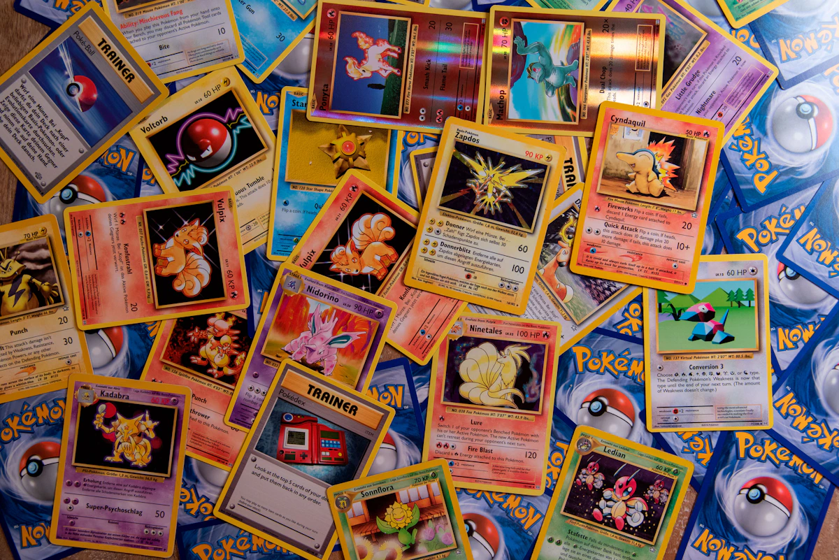 Pokémon trading card collection spread out on a surface